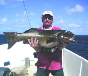 Brad shows off a 30kg GT caught out near the reef off Airlie Beach recently.